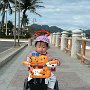 Vietnam - Nha- Trang- Boy on - bike at beach