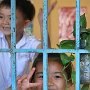 Vietnam - Saigon  school kids in window