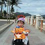 Vietnam - Nha- Trang- Boy on - bike at beach