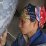 Woman painting vase, Vietnam 